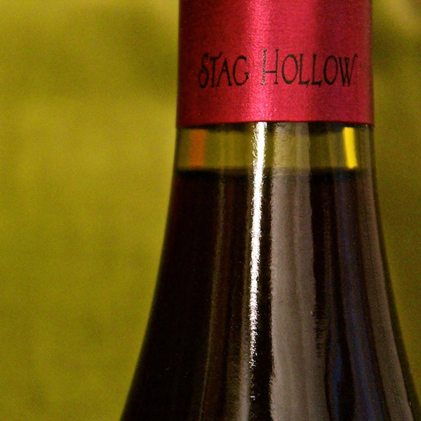 Close up of the Stag Hollow red label at the top of a wine bottle
